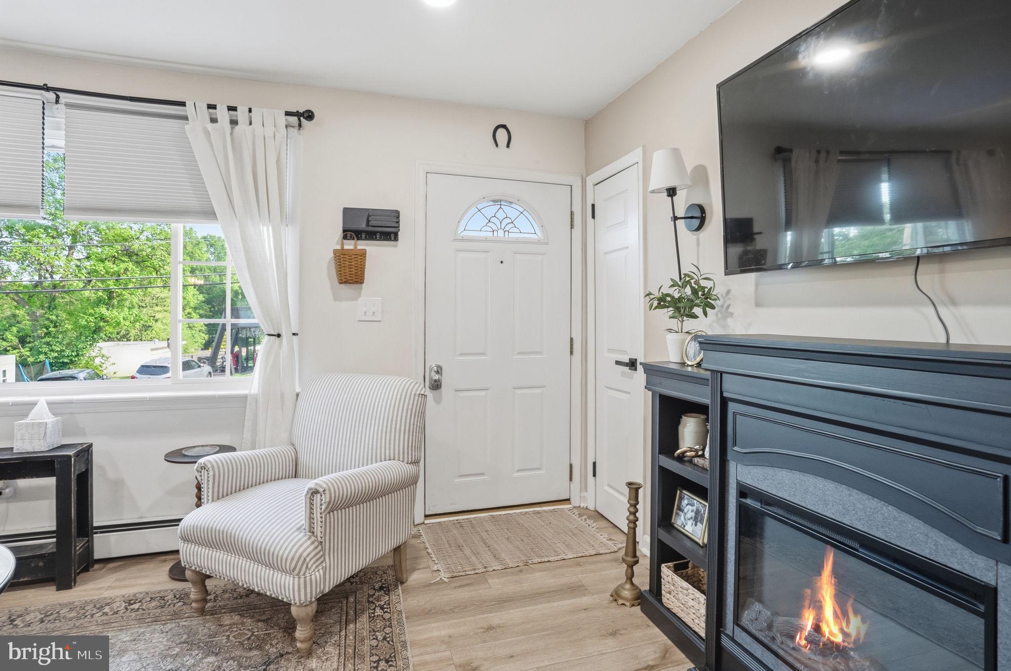 303 Radcliffe Road Glenside, PA 19038 - Photo 2 of 36 a living room with furniture and a large window