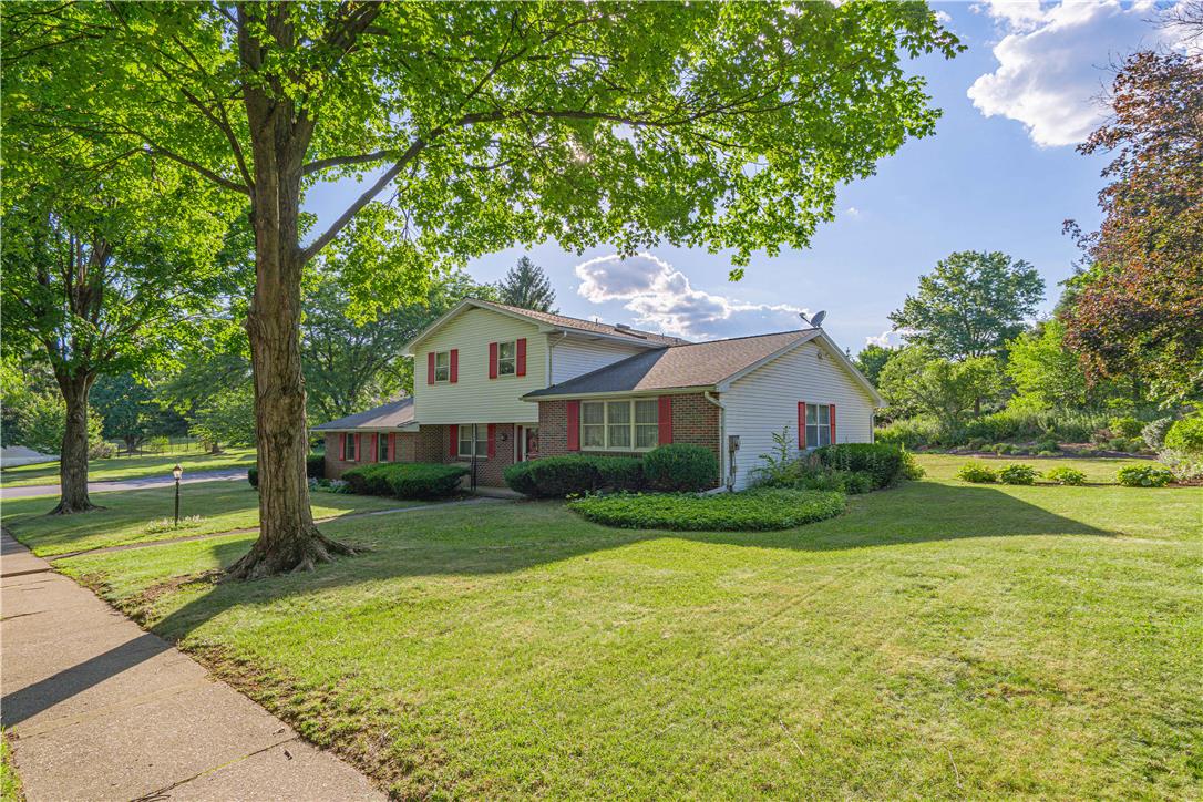 5425 Clauser Road Orefield, PA 18069 - Photo 4 of 18 Mature trees and neat landscaping frame this welcoming suburban residence, offering classic curb appeal.