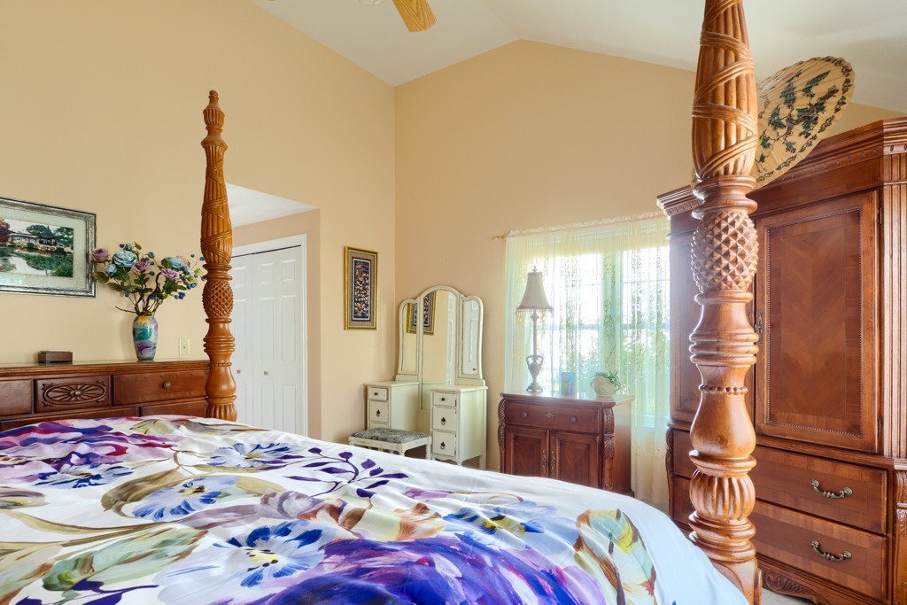 125 Shire Road, Unit 40 Leominster, MA 01453 - Photo 14 of 29 a bedroom with a bed and dresser with mirror