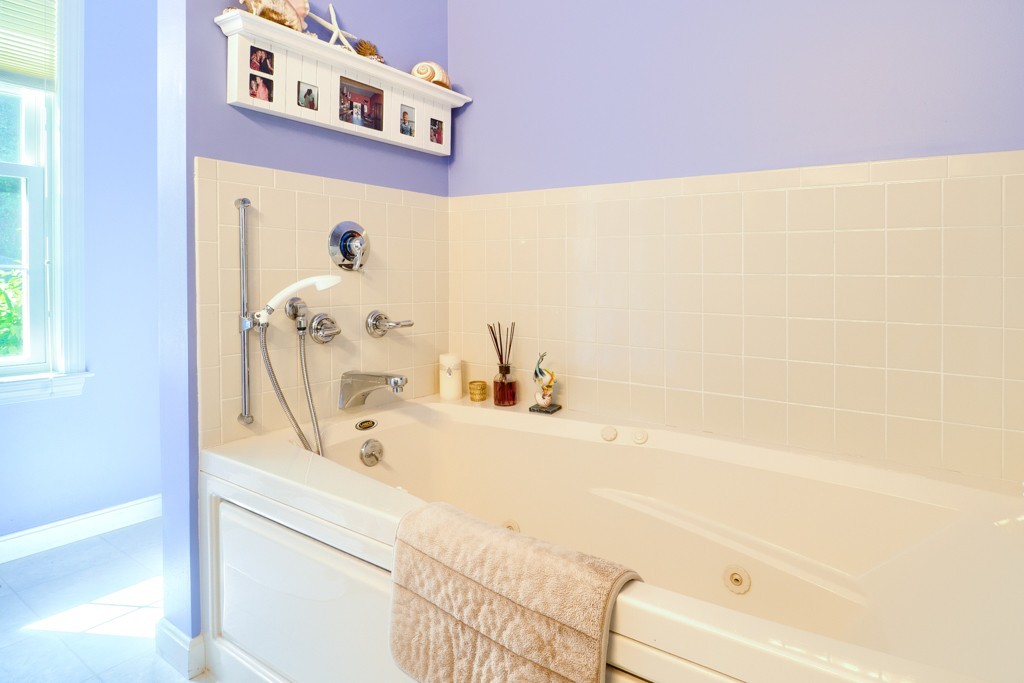 125 Shire Road, Unit 40 Leominster, MA 01453 - Photo 16 of 29 a bathroom with a bathtub and a shower