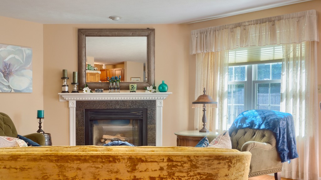 125 Shire Road, Unit 40 Leominster, MA 01453 - Photo 3 of 29 a living room with a fireplace furniture and a large window