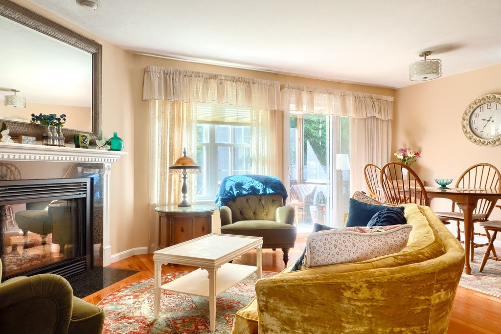 125 Shire Road, Unit 40 Leominster, MA 01453 - Photo 4 of 29 a living room with furniture and a fireplace