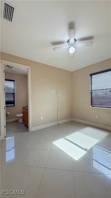 4310 4th Street Southwest Lehigh Acres, FL 33976 - Photo 15 of 27 a view of a livingroom with a ceiling fan and window