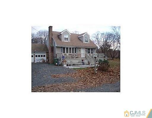 603 A Old Post Road Edison, NJ 08817 - Photo 1 of 9 a view of a big house with a big yard and large tree