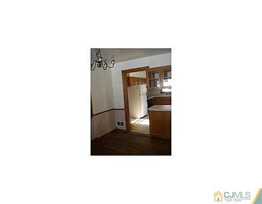 603 A Old Post Road Edison, NJ 08817 - Photo 3 of 9 a bathroom with a sink and a mirror