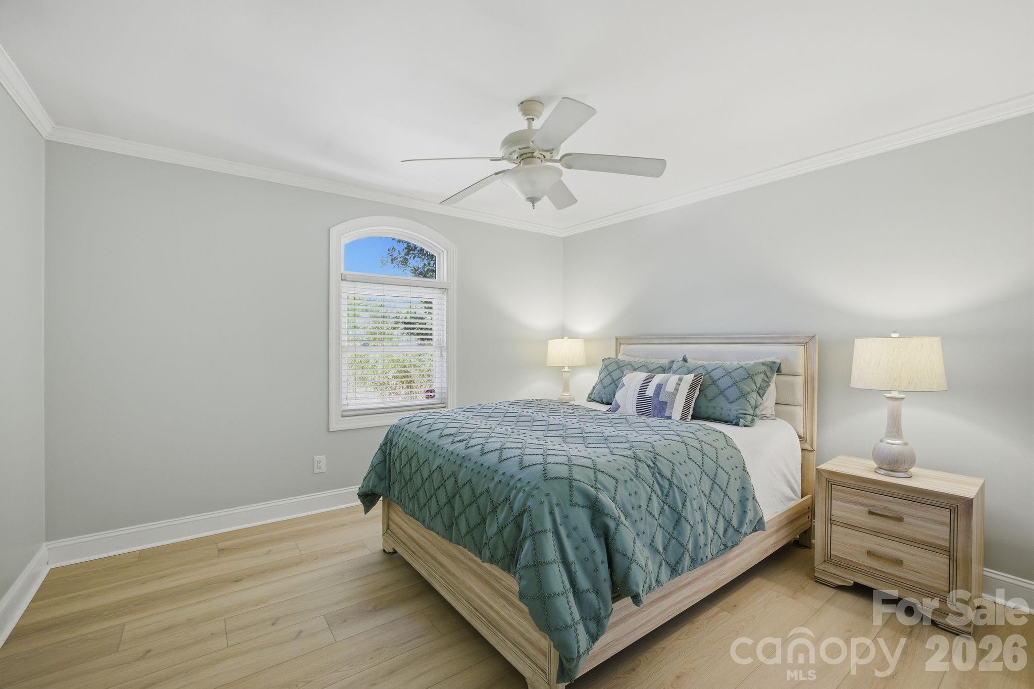 21326 Sandy Cove Road Cornelius, NC 28031 - Photo 15 of 21 a bedroom with a bed and a window