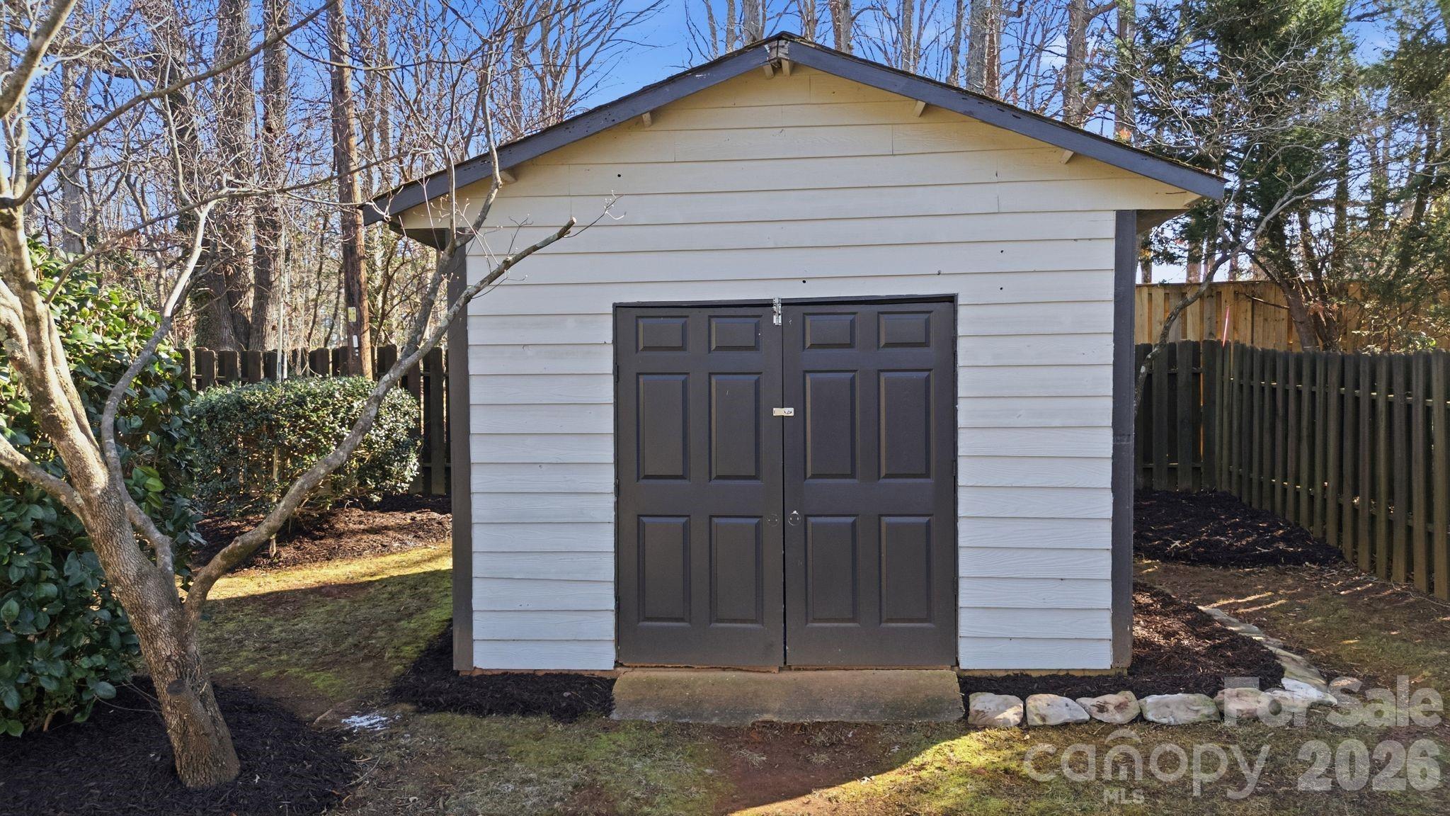 21326 Sandy Cove Road Cornelius, NC 28031 - Photo 19 of 21 a front view of a house with a yard