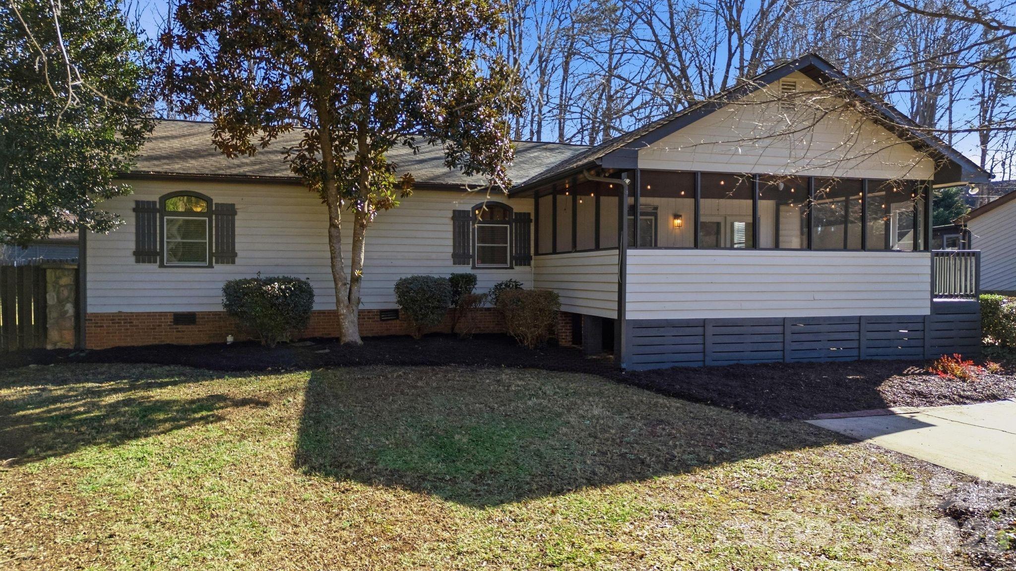 21326 Sandy Cove Road Cornelius, NC 28031 - Photo 2 of 21 a front view of a house with garden
