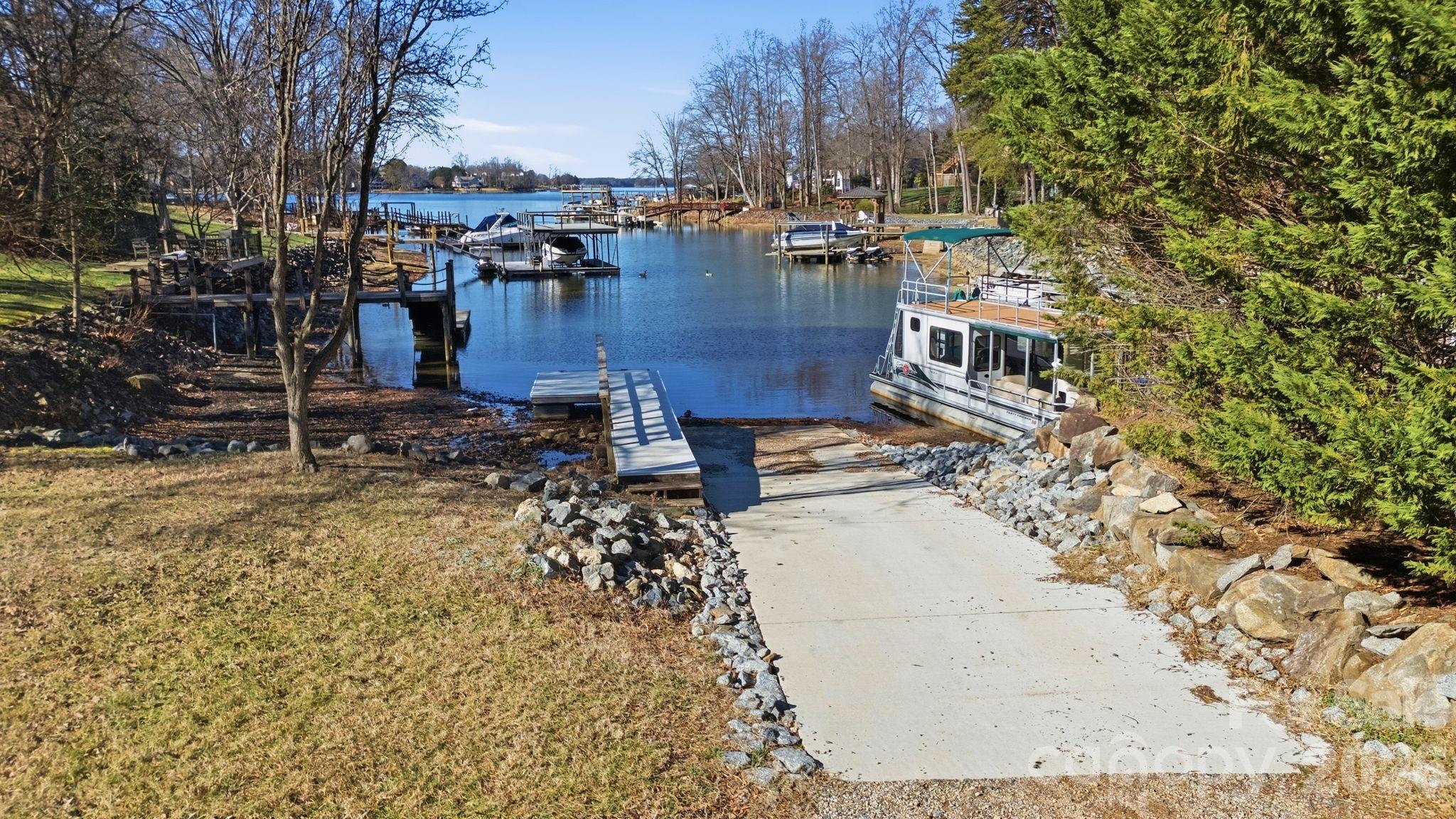 21326 Sandy Cove Road Cornelius, NC 28031 - Photo 21 of 21 a view of a yard with wooden fence