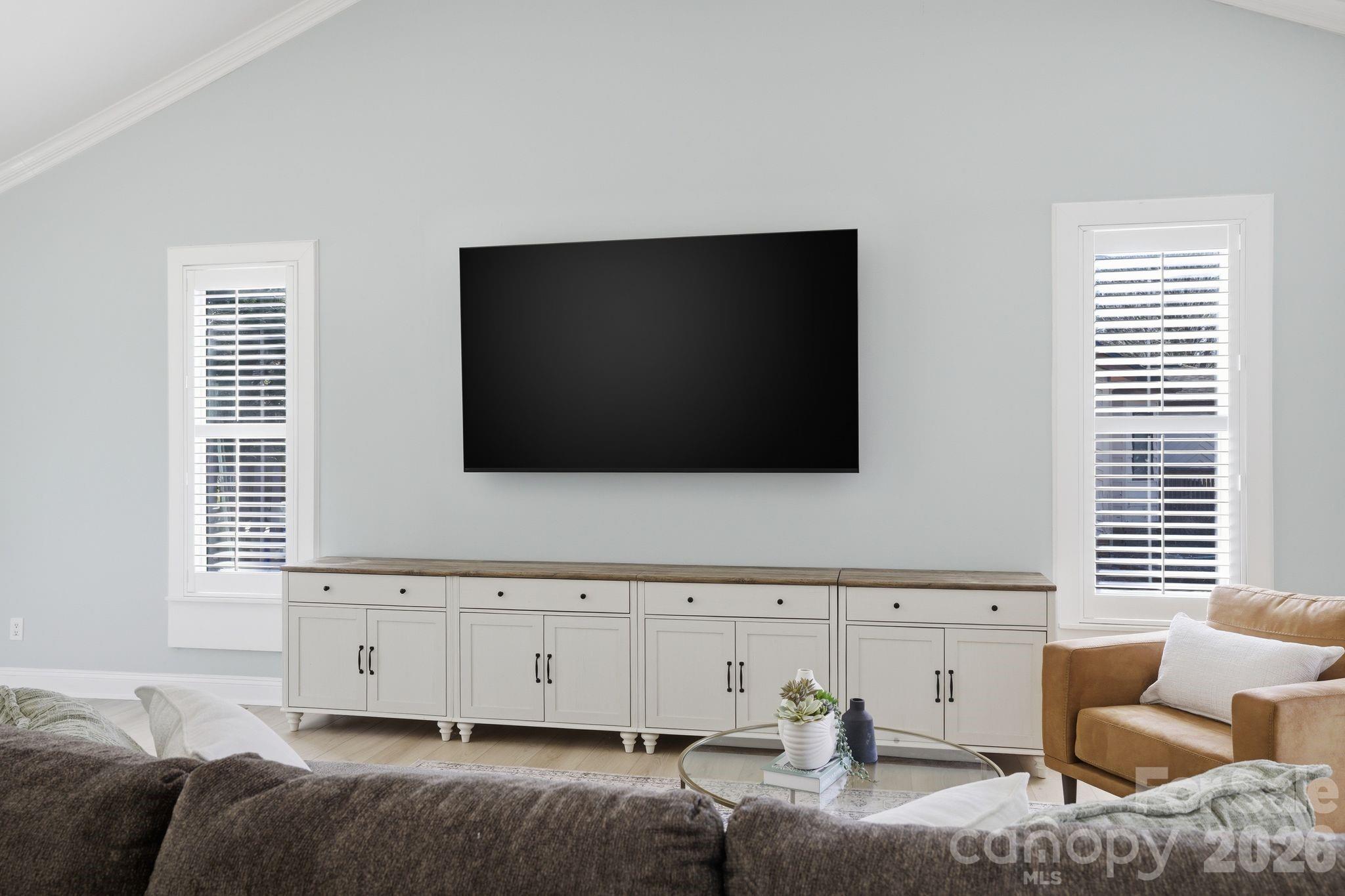 21326 Sandy Cove Road Cornelius, NC 28031 - Photo 7 of 21 a living room with furniture and a flat screen tv