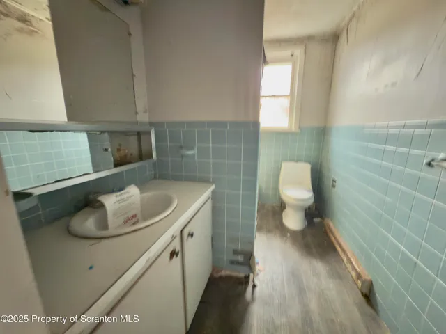 a view of a big room with wooden walls