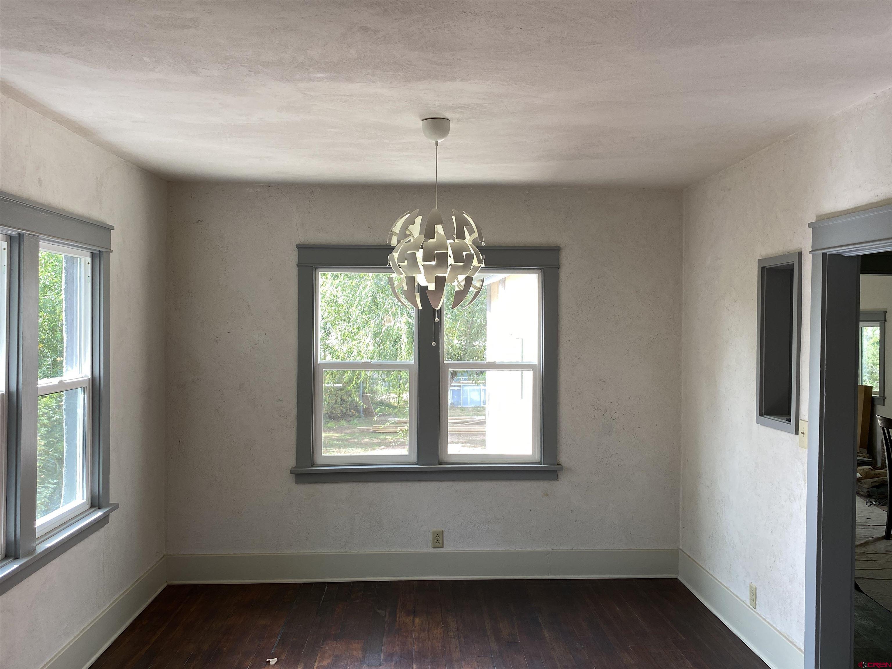 121 South Washington Street Cortez, CO 81321 - Photo 11 of 33 a decorative lighting in a room next to a window
