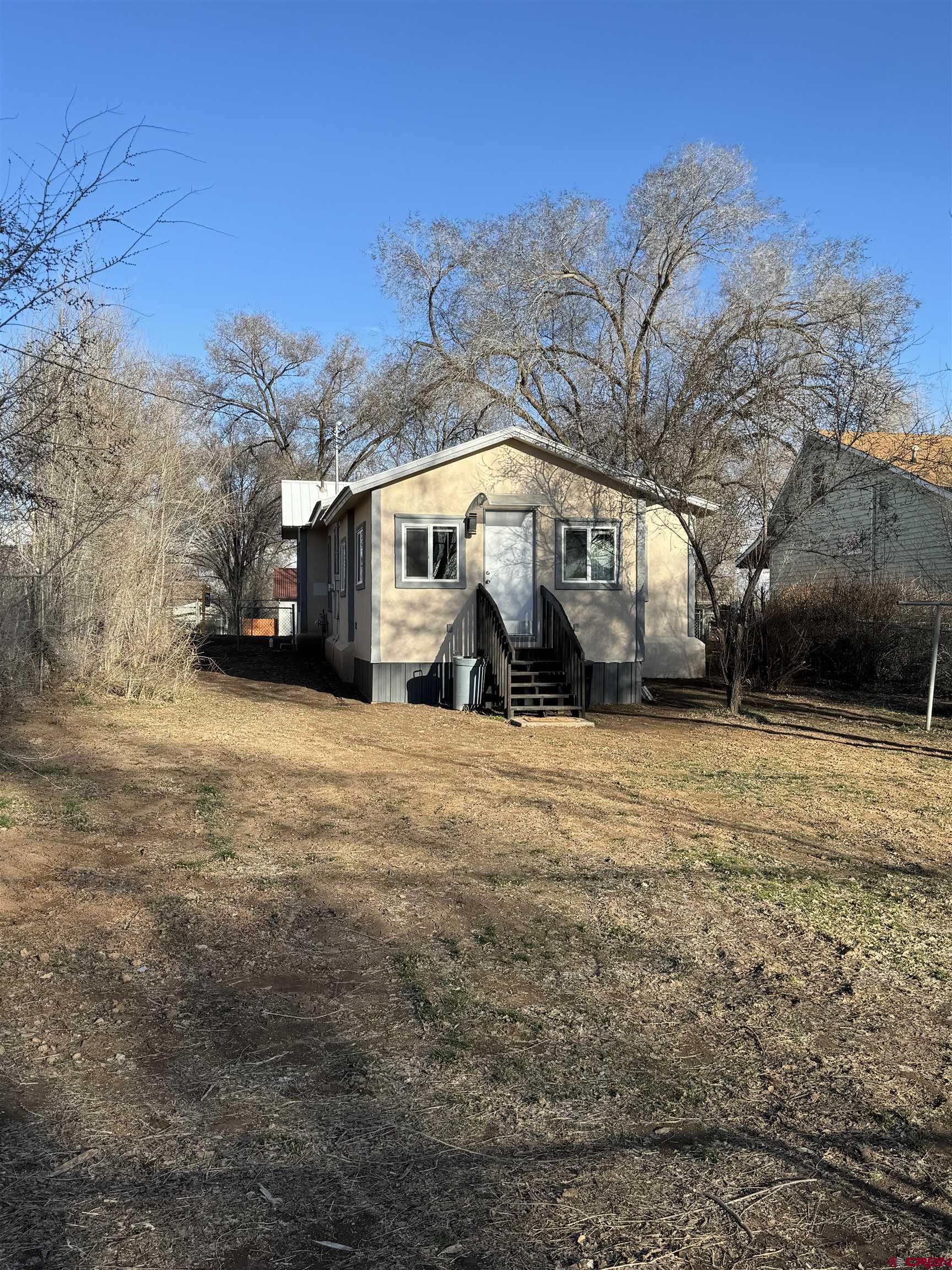 121 South Washington Street Cortez, CO 81321 - Photo 13 of 33 a house view with a outdoor space