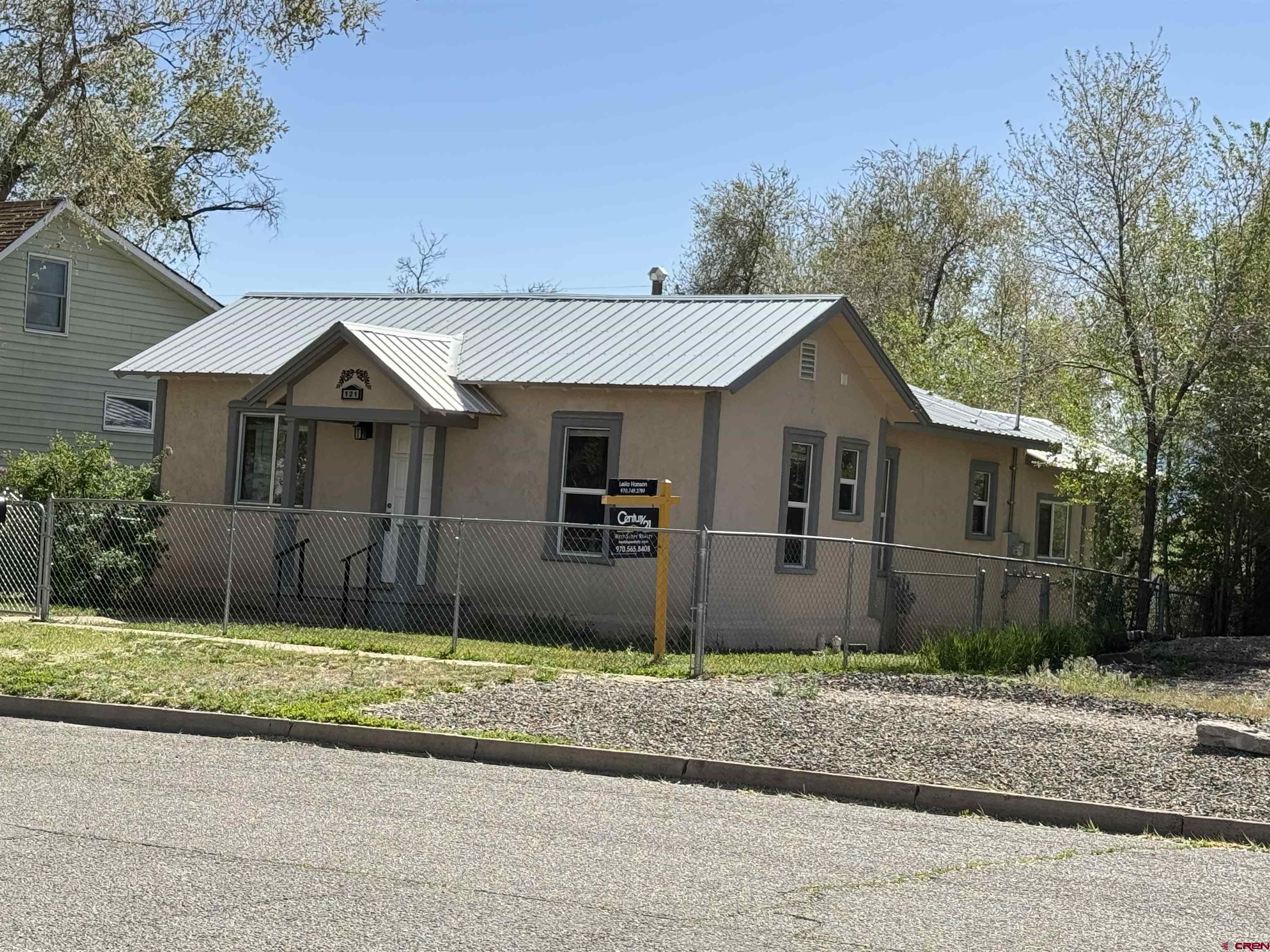 121 South Washington Street Cortez, CO 81321 - Photo 14 of 33 a front view of a house with a yard