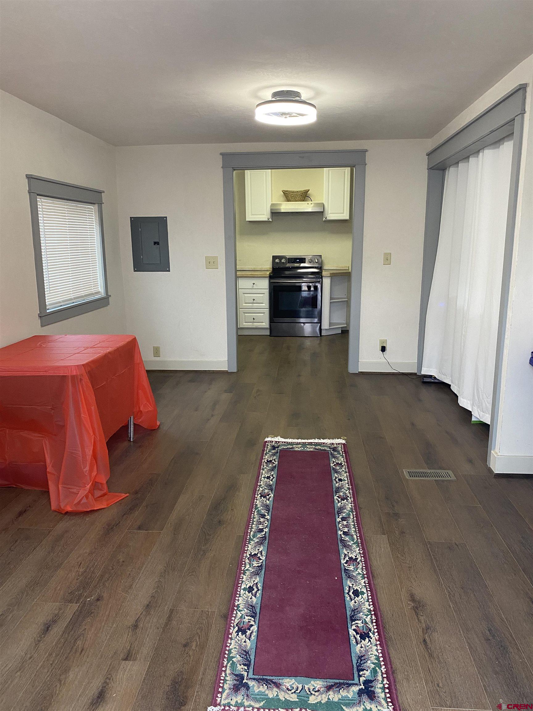 121 South Washington Street Cortez, CO 81321 - Photo 22 of 33 a living room with furniture and a rug