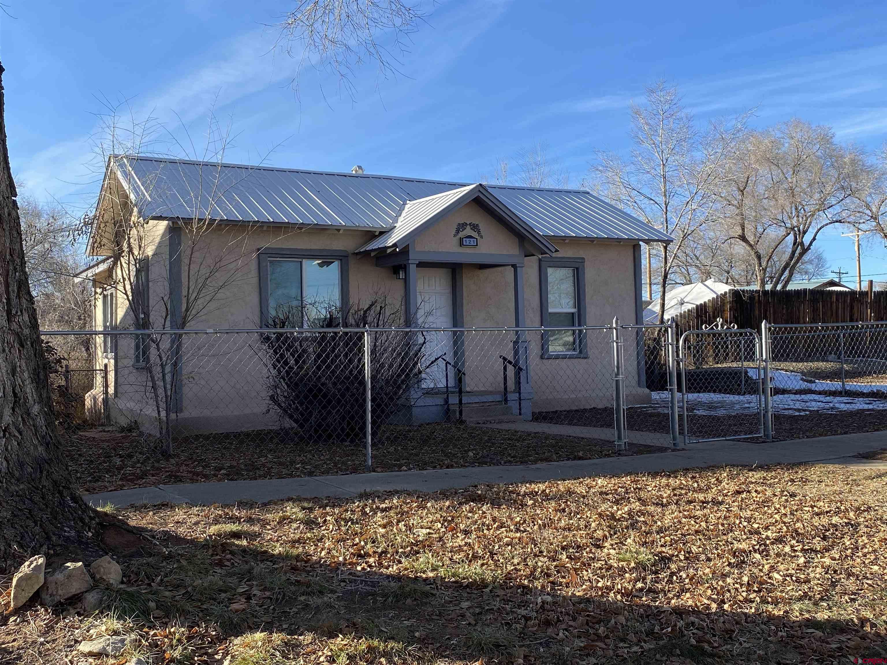 121 South Washington Street Cortez, CO 81321 - Photo 33 of 33 a front view of a house with garden