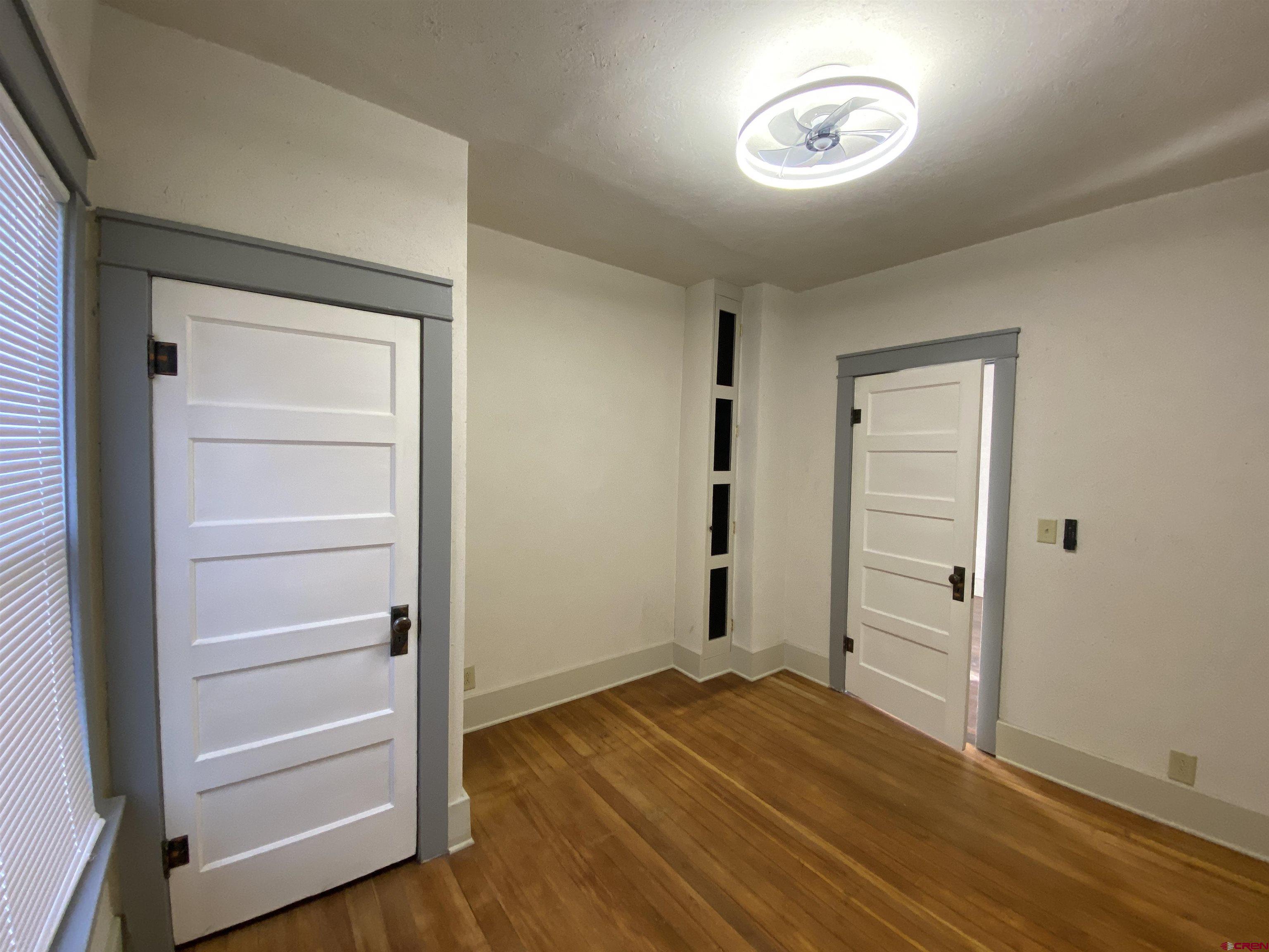 121 South Washington Street Cortez, CO 81321 - Photo 8 of 33 a view of a room with wooden floor