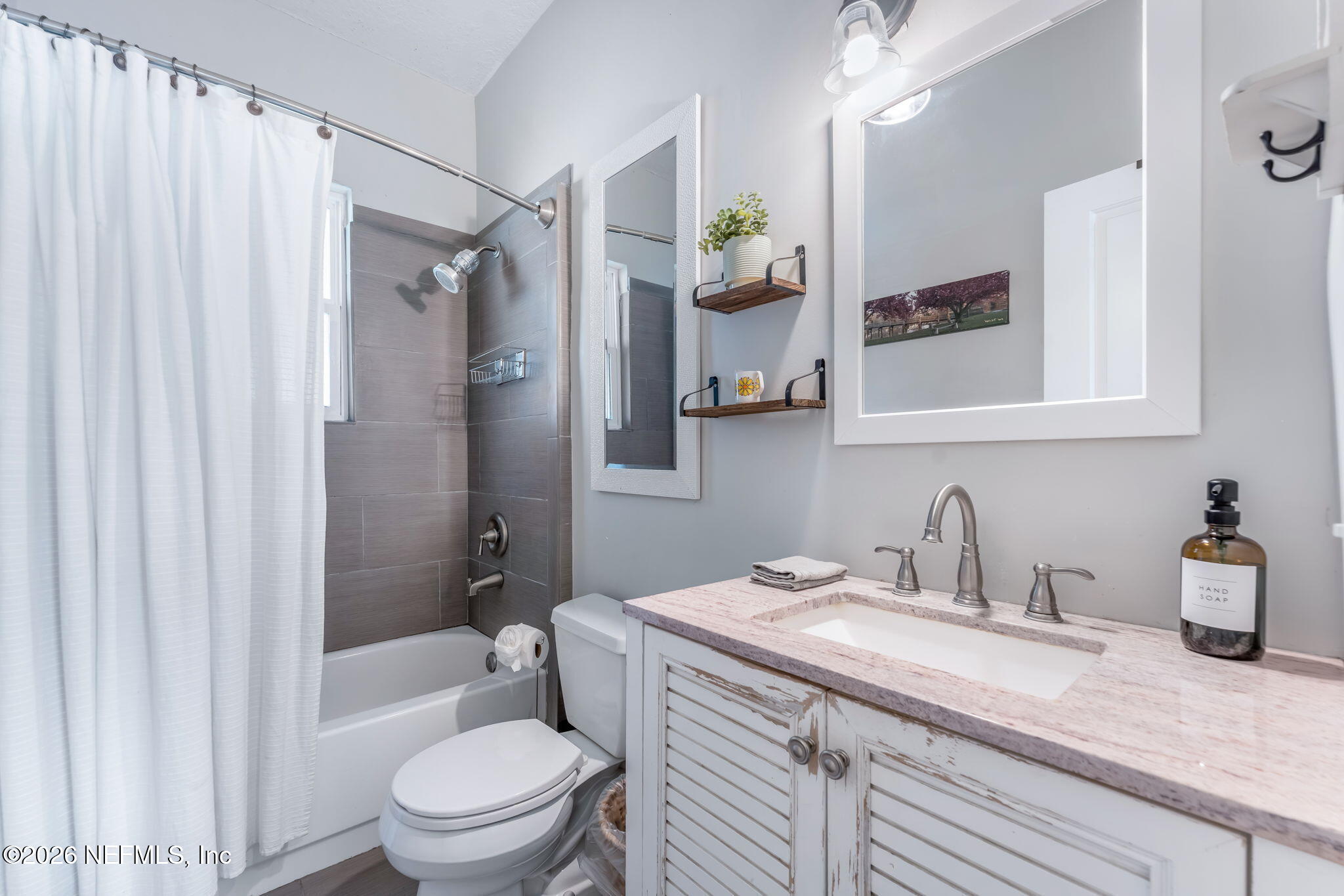 909 Cedar Street Jacksonville, FL 32207 - Photo 11 of 41 a bathroom with a granite countertop sink toilet and shower