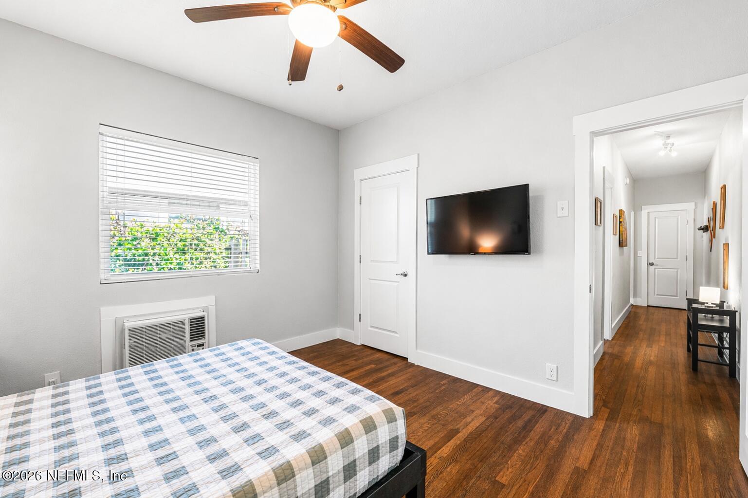 909 Cedar Street Jacksonville, FL 32207 - Photo 25 of 41 a bedroom with a bed and a flat screen tv