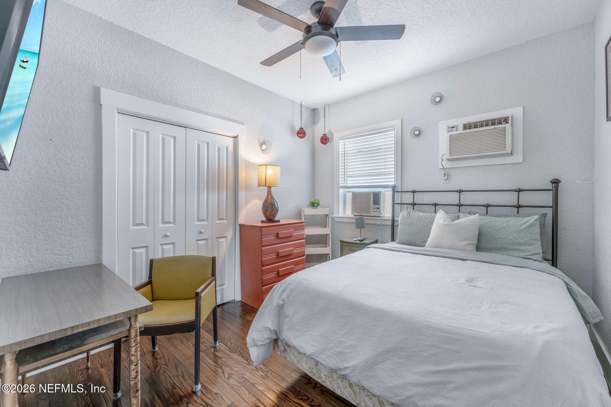 909 Cedar Street Jacksonville, FL 32207 - Photo 10 of 41 a bedroom with a bed a table and chair