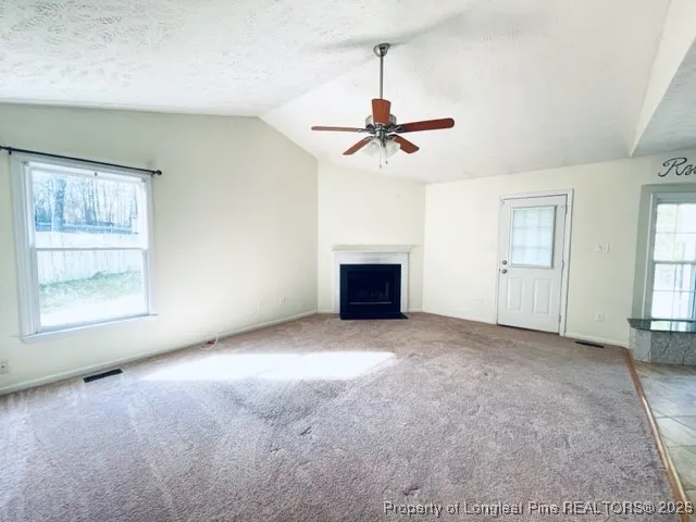 a view of empty room with windows