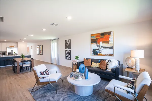 a kitchen with a refrigerator sink and stove