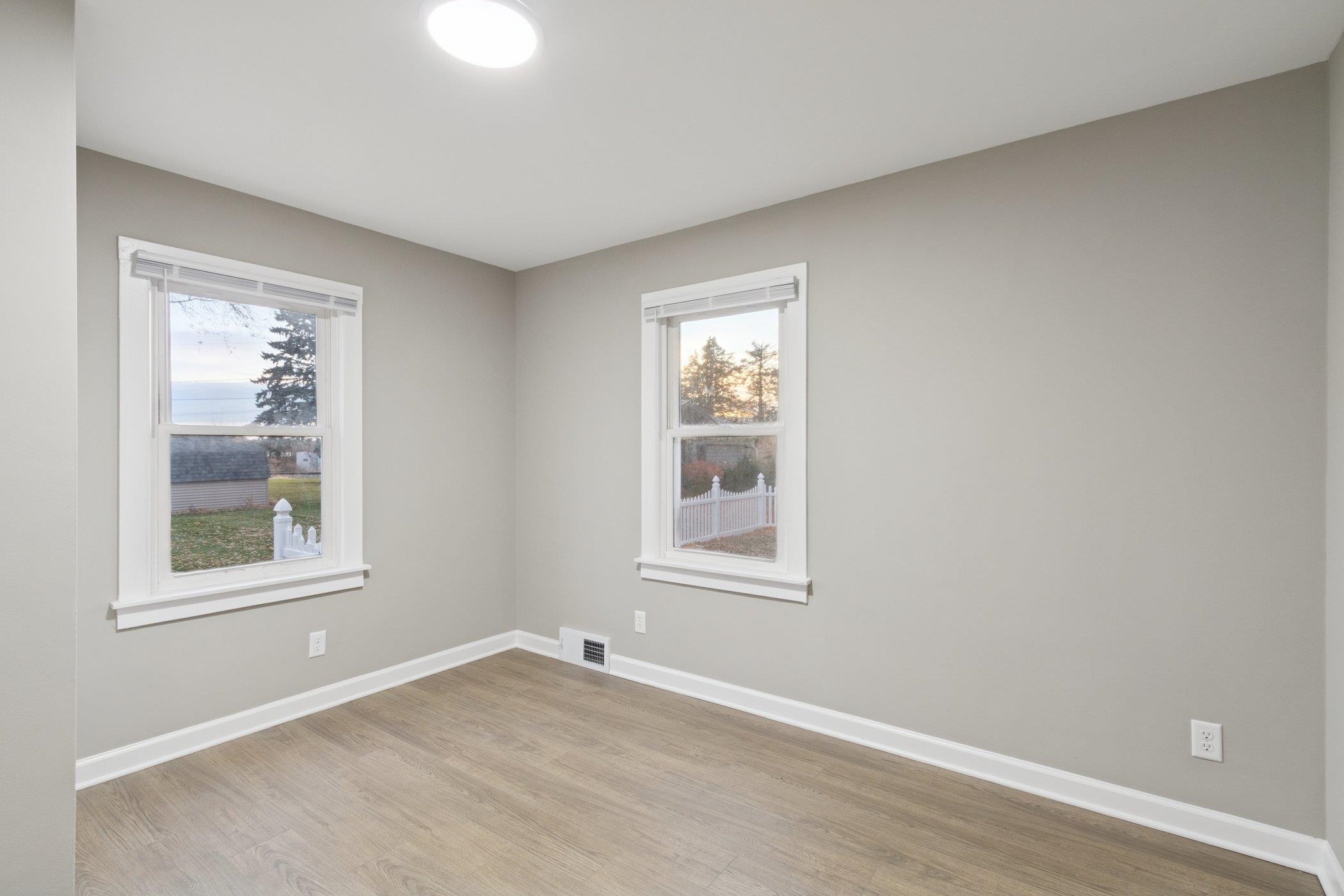 519 South Sycamore Street Genoa, IL 60135 - Photo 16 of 36 an empty room with windows and closet
