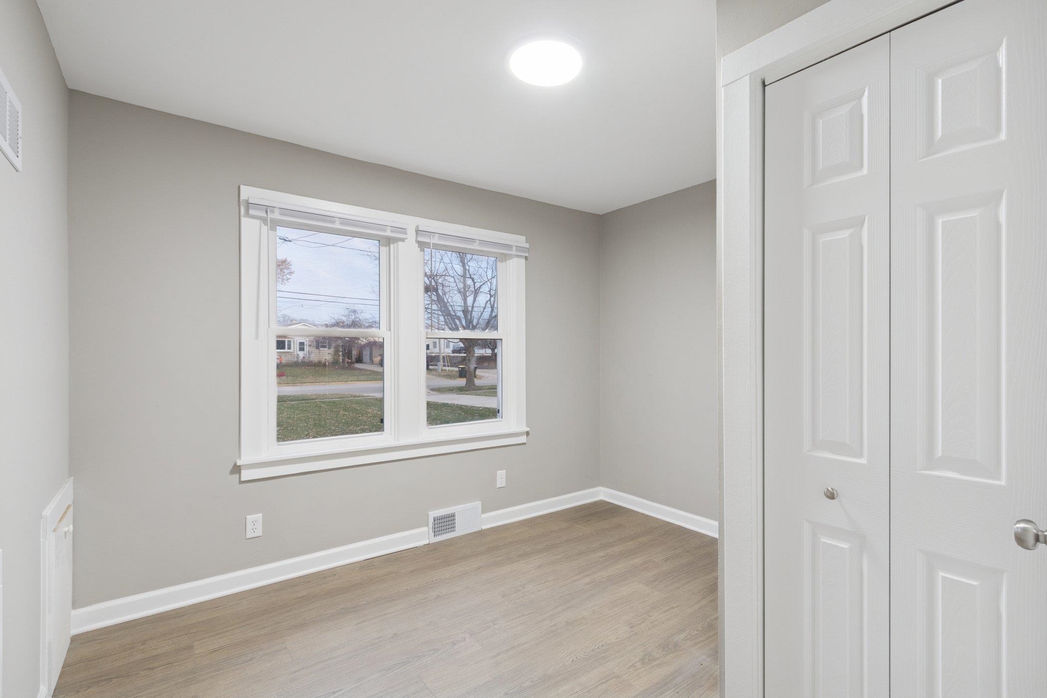 519 South Sycamore Street Genoa, IL 60135 - Photo 18 of 36 an empty room with a window