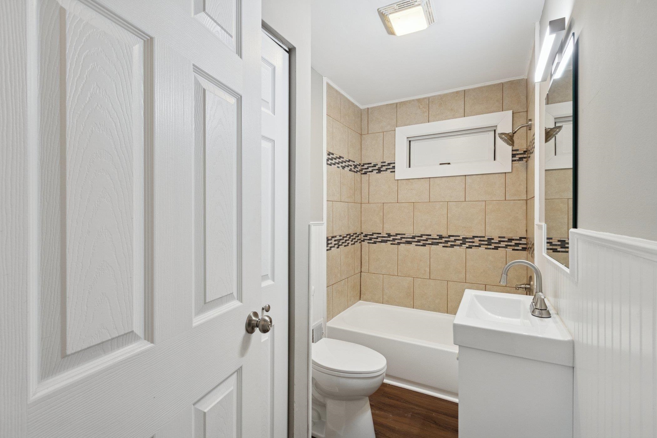 519 South Sycamore Street Genoa, IL 60135 - Photo 20 of 36 a bathroom with a sink a toilet and shower