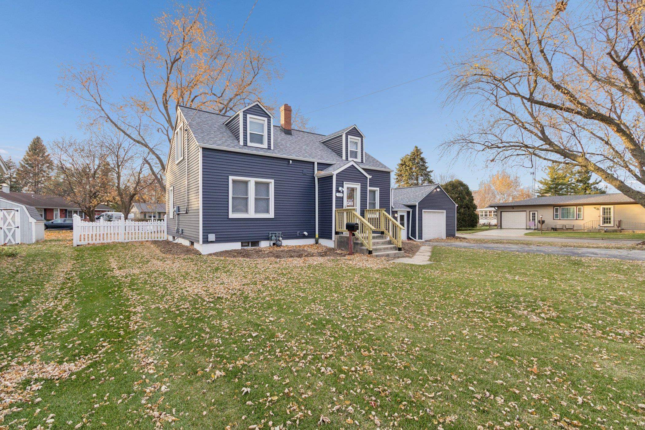 519 South Sycamore Street Genoa, IL 60135 - Photo 2 of 36 a front view of a house with a yard