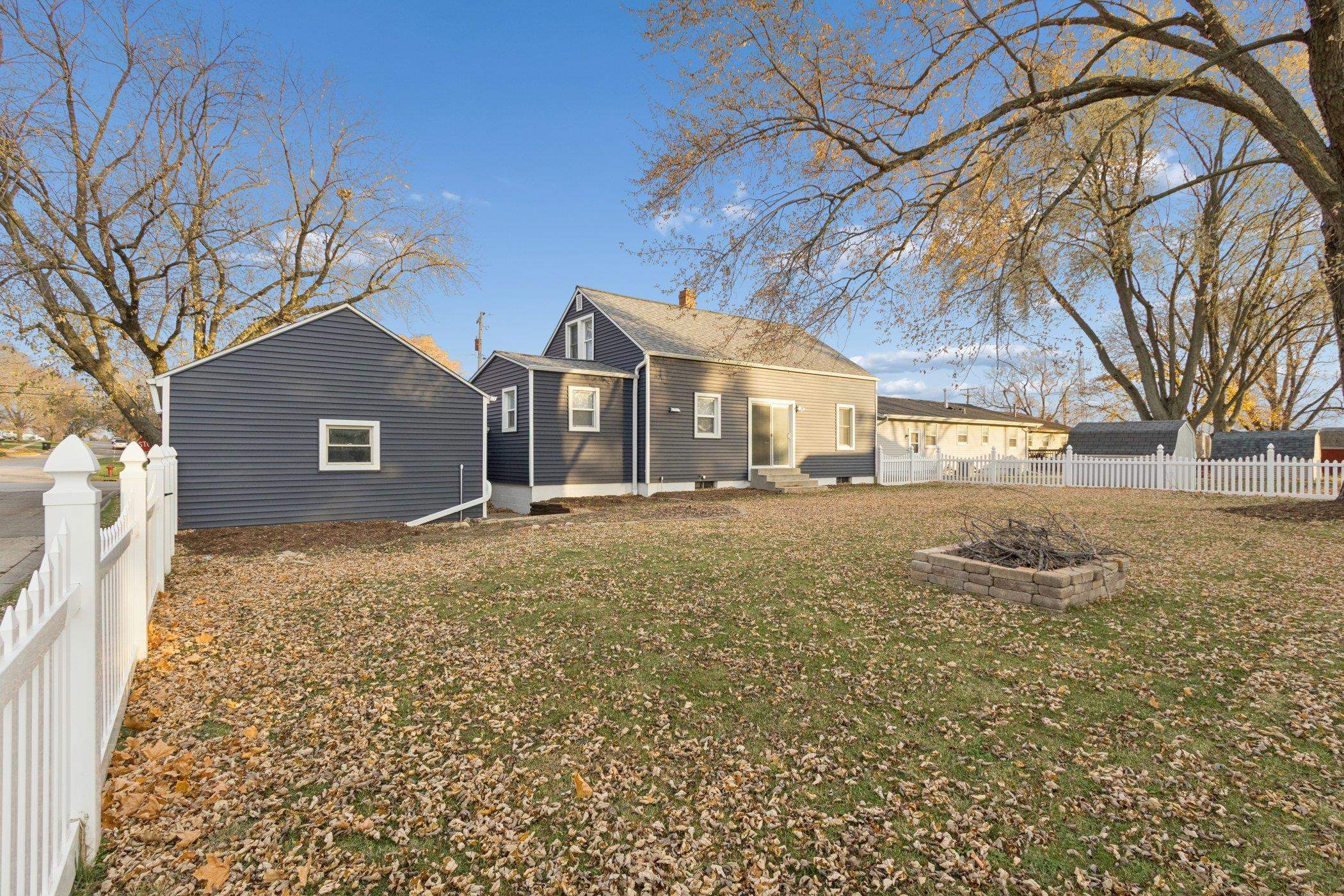 519 South Sycamore Street Genoa, IL 60135 - Photo 32 of 36 a front view of a house with a yard