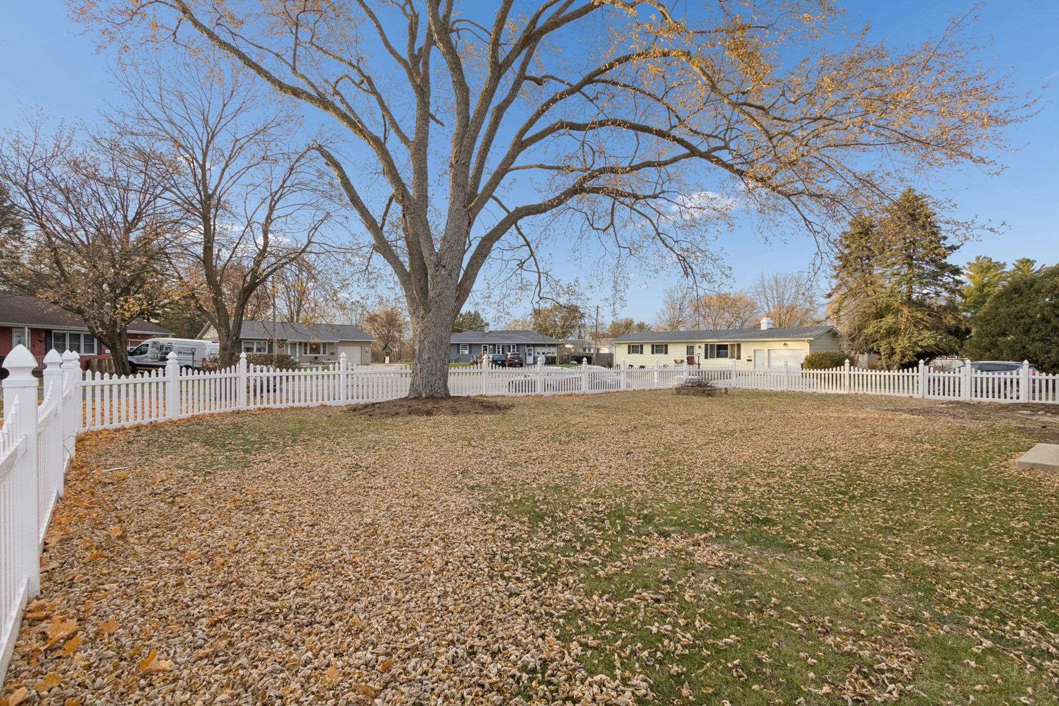 519 South Sycamore Street Genoa, IL 60135 - Photo 35 of 36 a view of a yard with trees