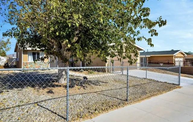 a view of a yard with an outdoor space