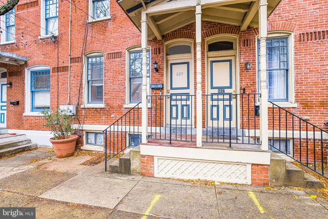 a view of front a house with outdoor seating