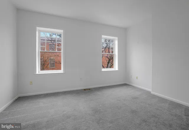 an empty room with windows