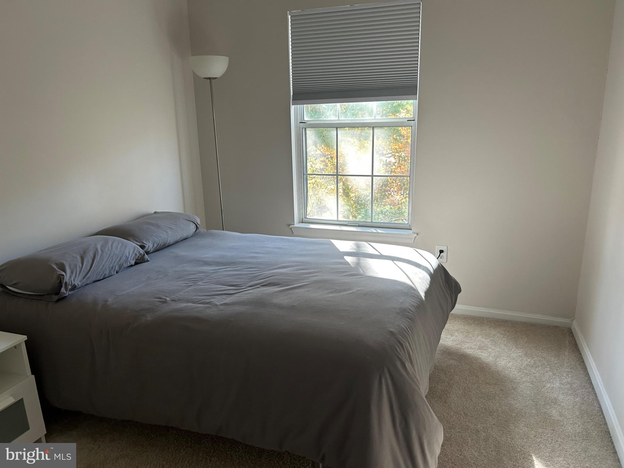 5833 Pin Oak Commons Court Burke, VA 22015 - Photo 12 of 15 a bedroom with a bed and a window
