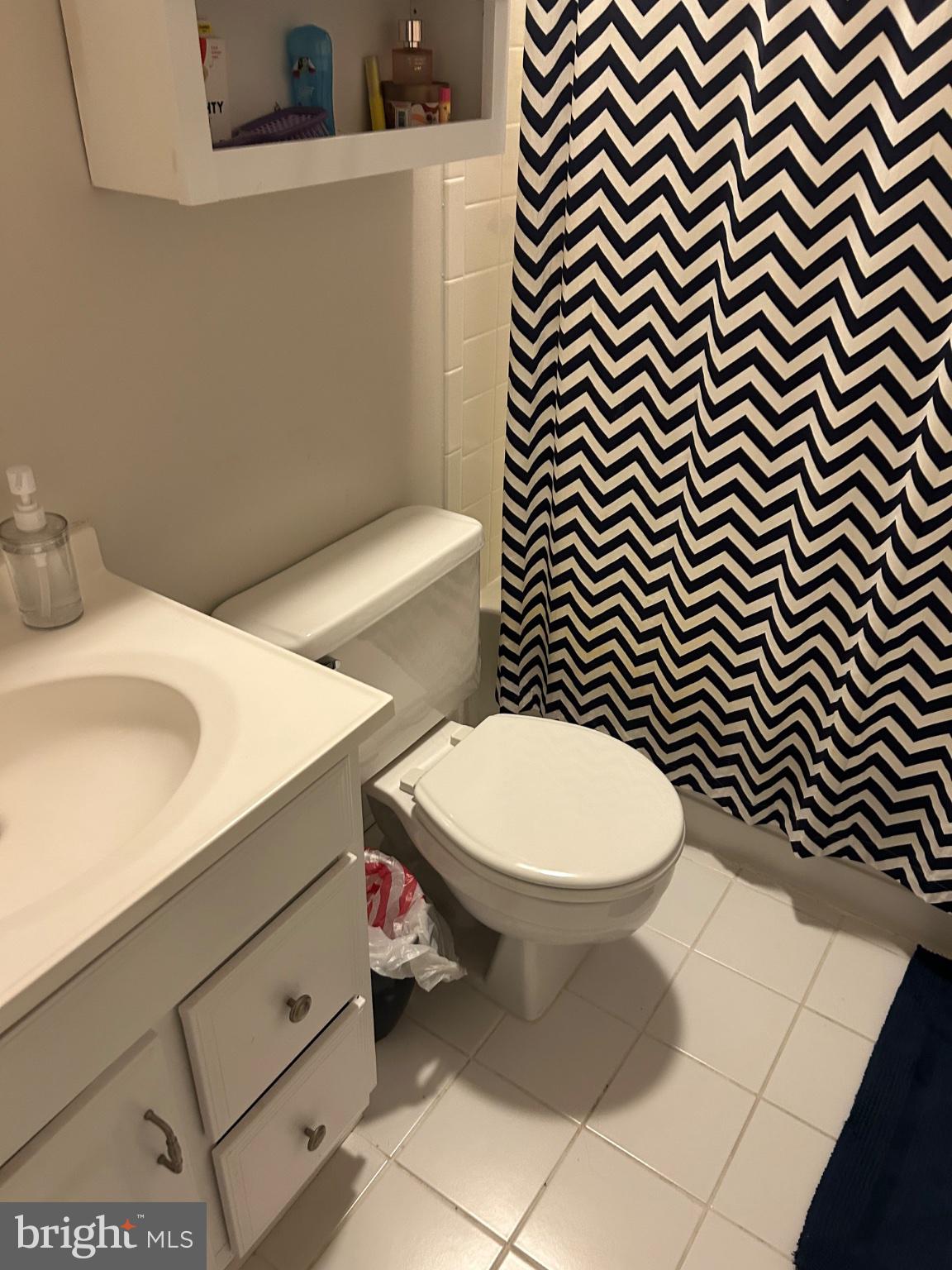 5833 Pin Oak Commons Court Burke, VA 22015 - Photo 13 of 15 a bathroom with a toilet and a sink
