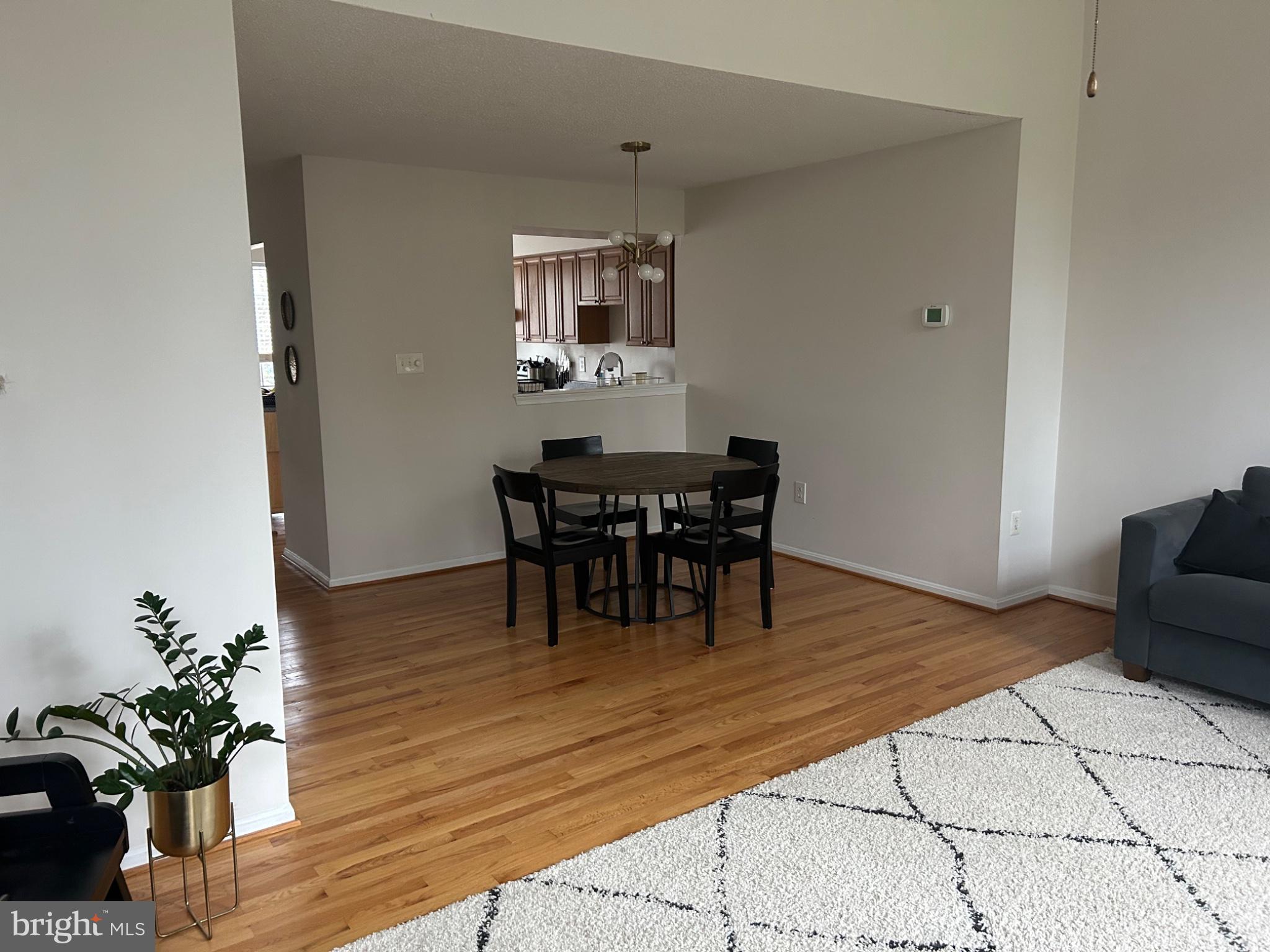5833 Pin Oak Commons Court Burke, VA 22015 - Photo 4 of 15 a view of a dining room with furniture