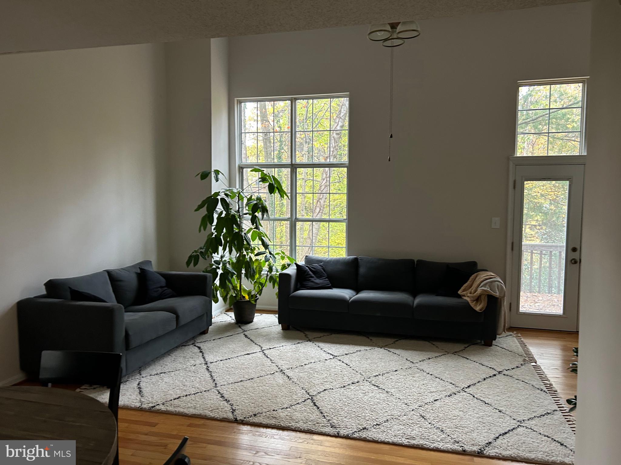5833 Pin Oak Commons Court Burke, VA 22015 - Photo 5 of 15 a living room with furniture and window