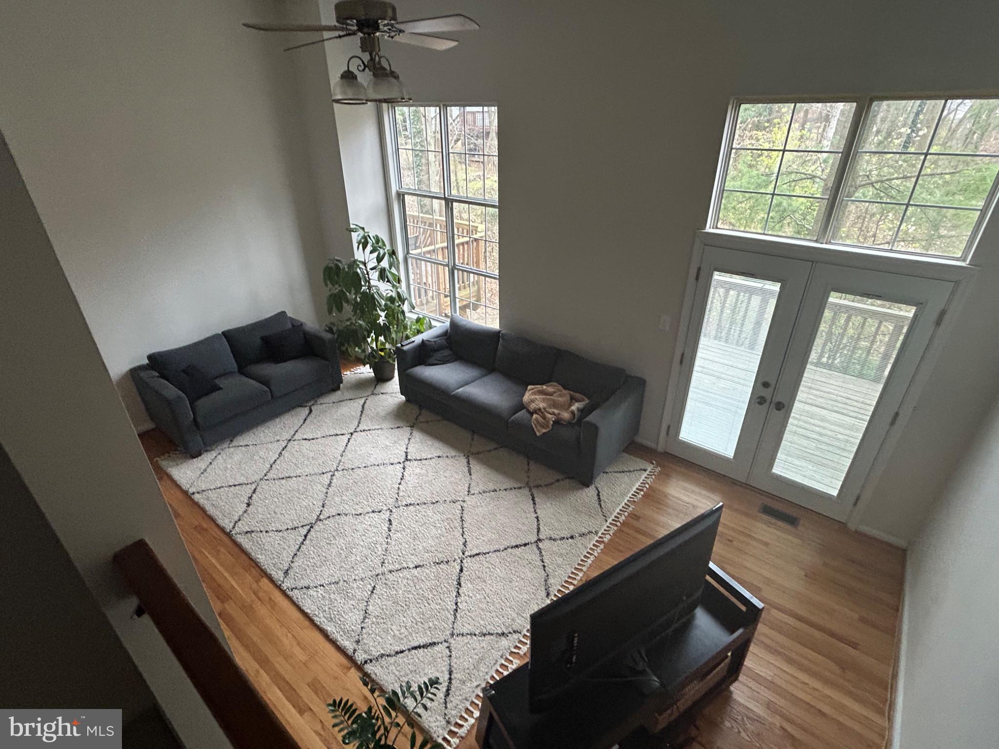 5833 Pin Oak Commons Court Burke, VA 22015 - Photo 6 of 15 a living room with furniture and a window