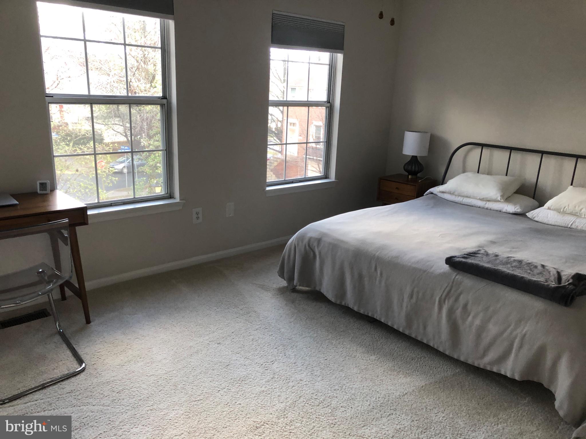 5833 Pin Oak Commons Court Burke, VA 22015 - Photo 10 of 15 a bedroom with a bed and window