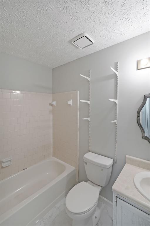 3087 Drexel Lane Rex, GA 30273 - Photo 16 of 22 a white toilet sitting next to a bath tub