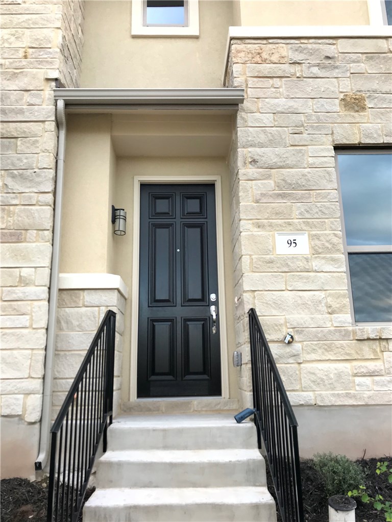 6814 East Riverside Drive, Unit 95 Austin, TX 78741 - Photo 1 of 23 a view of a balcony with wooden floor and fence