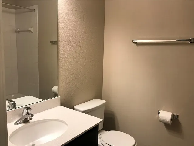 a bathroom with a sink a toilet