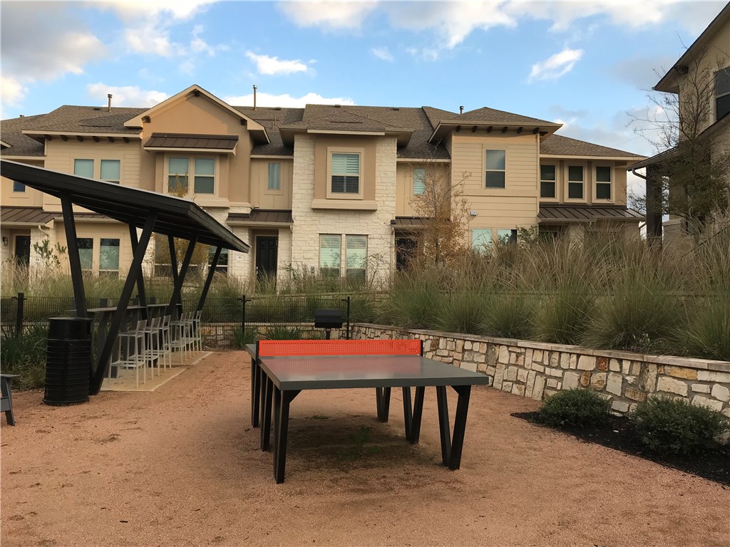 6814 East Riverside Drive, Unit 95 Austin, TX 78741 - Photo 23 of 23 a backyard of a house with a yard and seating space
