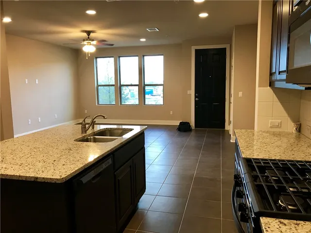 a kitchen with a sink and a window