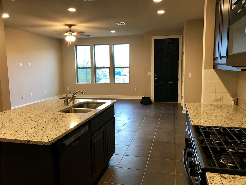 6814 East Riverside Drive, Unit 95 Austin, TX 78741 - Photo 6 of 23 a kitchen with a sink and a window