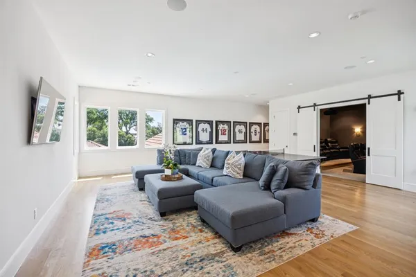 a living room with furniture window and table