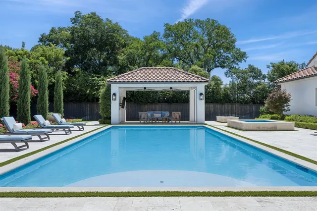 a view of outdoor space with swimming pool and furniture