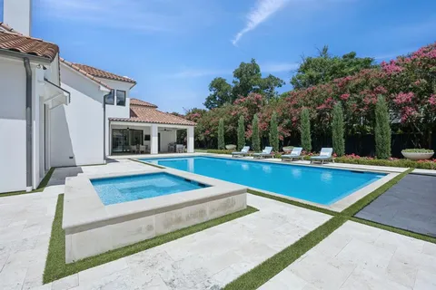 a view of outdoor space with swimming pool and trees